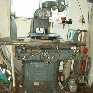 This is a Norton 6 x 18 hydraulic surface grinder, or as it was called in its day, "grinding machine" It was built in 1942, the same year that it's designer,Charles H. Norton, died. I am in the process of fixing it up a bit, as it lacks some minor parts.