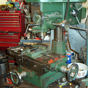 The Jet-16 Drilling & Milling Machine. 12 speeds, 9 3/8" x 23 1/2" table. It's missing the pulley covers, and therefore unfortunately the speed chart as well. But I got me a little 'lectronic tacho gaget, and one day I'll play me some "musical fan belts" and draw me up a chart.