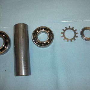spindle assembly order starting at top of bearing set moving to the right (up the spindle)