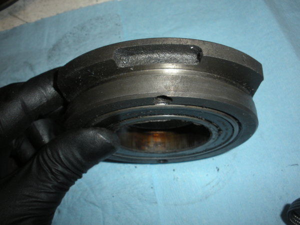 Brake bearing cap after removal. Old bearing still in place. Another edge view but on one of the short sides.