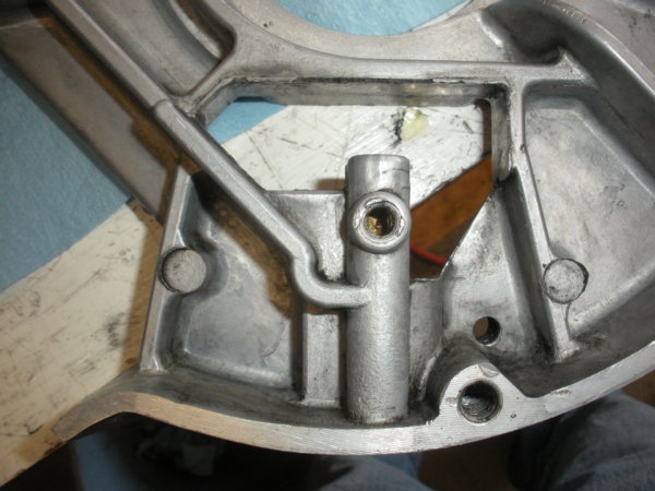 Cleaned up view of brake operating finger pivot stud (set screw) area. on the bottom of the lower belt housing.
