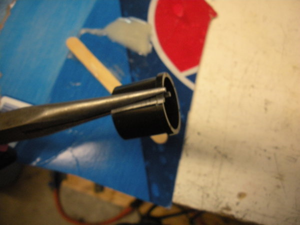 Over lap the bushing like this and hold it with a pair of needle nose pliers while you insert it. Lip towards the center of the pulley.