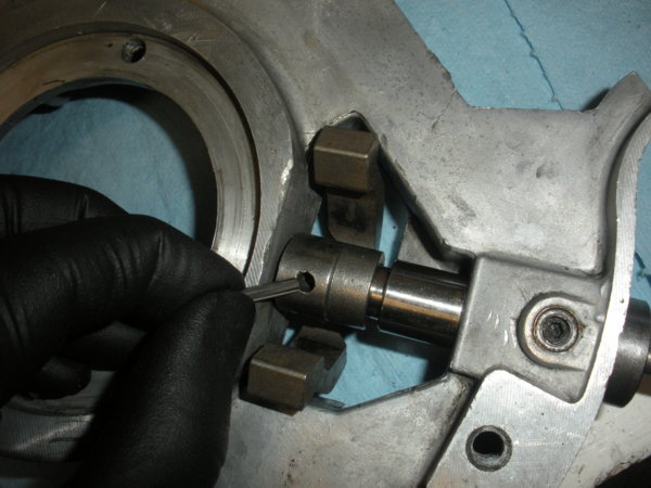 Reinstall the roll pin through the brake operating cam.