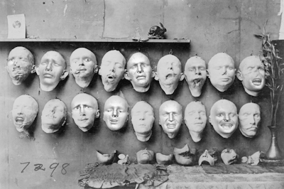 faces on the wall.gif