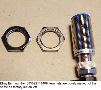 Ebay Item number 385822111489 Item nuts are poorly made, not the same as factory nut on left.jpg
