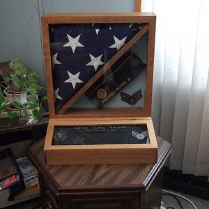 Burial flag display case for my late Father. I had his squadron insignia and his chevrons included in the engraving in hopes of helping to tell the story of his life for future generations.