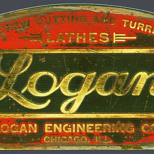 LoganBadge2 - Original early example of the Logan emblem. Background is the Benjamin Moore Baby Seal Grey color that is a very close math to the original.