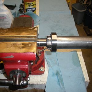 Mount the spindle in the vise (with soft jaws or covered in brass like mine.) Bearings on the right side this time.