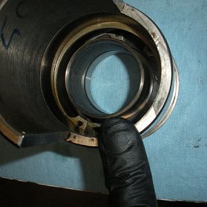 Installing the bearing spacer into the bull gear bearing sleeve. Set it on the inner race of the bottom bearing.
