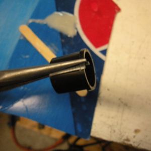 Over lap the bushing like this and hold it with a pair of needle nose pliers while you insert it. Lip towards the center of the pulley.