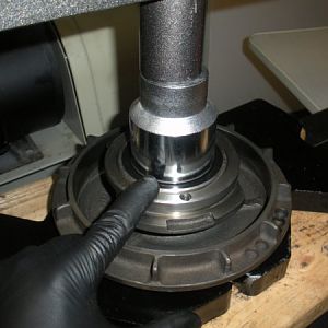 Press the brake bearing cap into place on the stationary vari-disc pulley. Press only on the INNER race of the bearing this time!