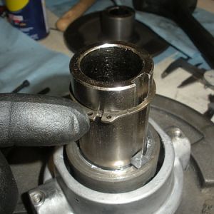 After sliding the bearing slidding housing on to the splindle gear hub. Yuo must fix it iplace using a snap ring.