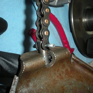 Connect the chain to the speed change plate like this using the t-bolt and the cotter key. Be sure and bend at least one leg out on the cotter key.