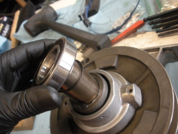 A new bearing (6007 double sealed) should be installed on top of the spindle pulley hub.