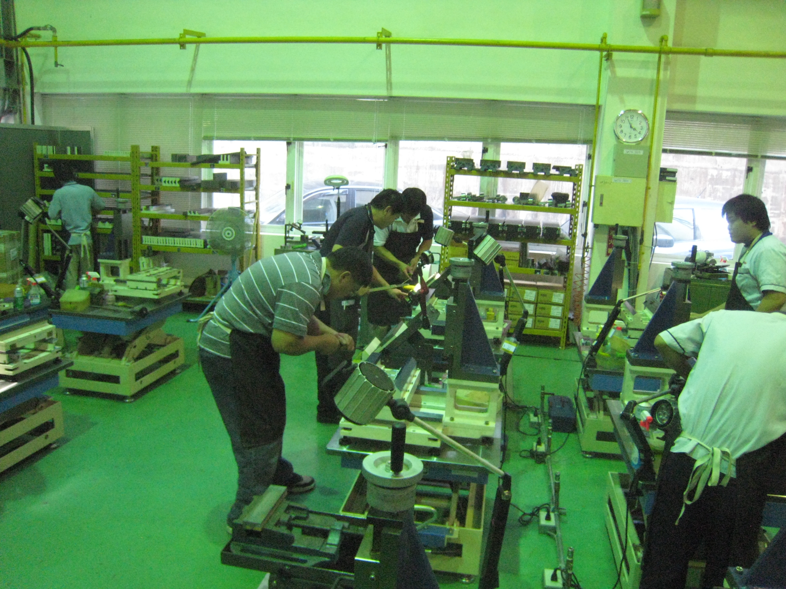 IMG 4014
Class room in Taiwan at PMC, Precision Machine Research Center.  See the special table we built and special fixtures we made to hold small mills we had the students scrape as a project.
