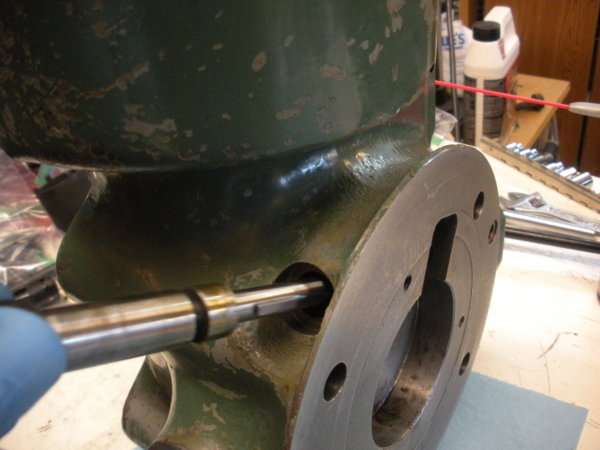 Insert the Head Tilting worm gear shaft while holding the gear in the slot. Align the key in the shaft with the gear.