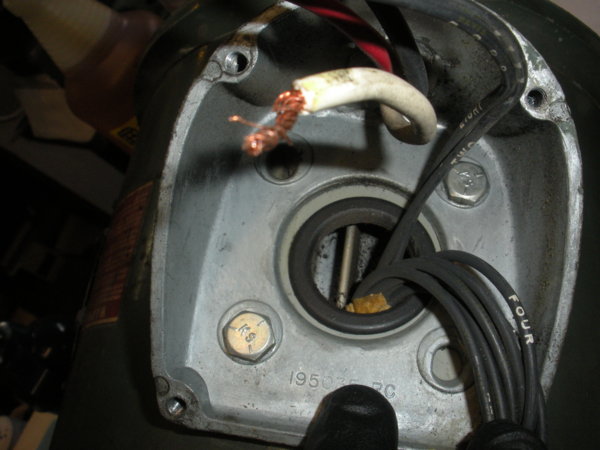 Inside the electrical box on side of motor.