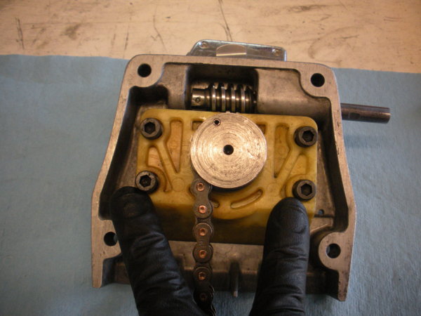Install the bearing block/speed change hub with the four cap screws as shown.