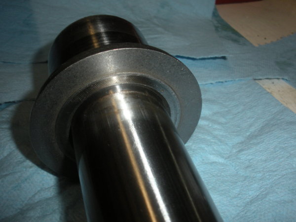 Install the bearing dirt shield like this on the spindle.