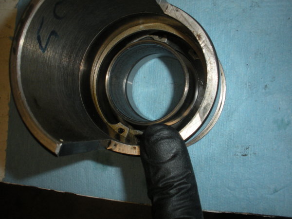 Installing the bearing spacer into the bull gear bearing sleeve. Set it on the inner race of the bottom bearing.