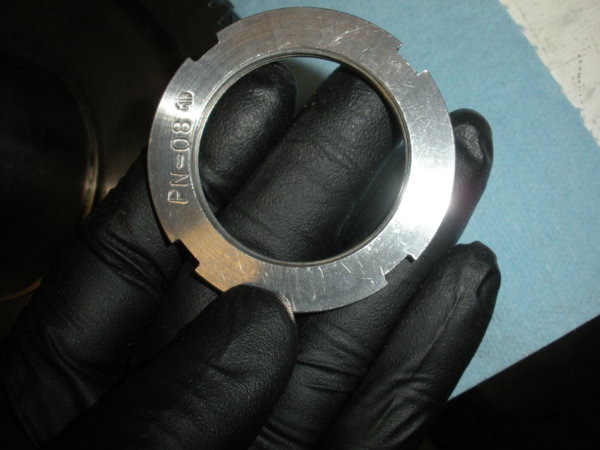 Lock nut top down view for holding the bull gear bearing sleeve in place.