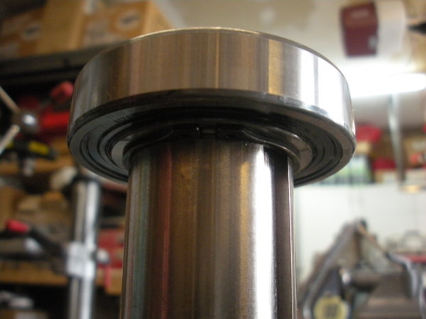 Lower view of the top spindle pulley hub bearing sitting directly on the snap ring.