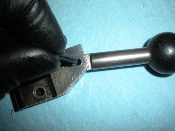 Once you have the handle inserted into the detent insert the roll pin.