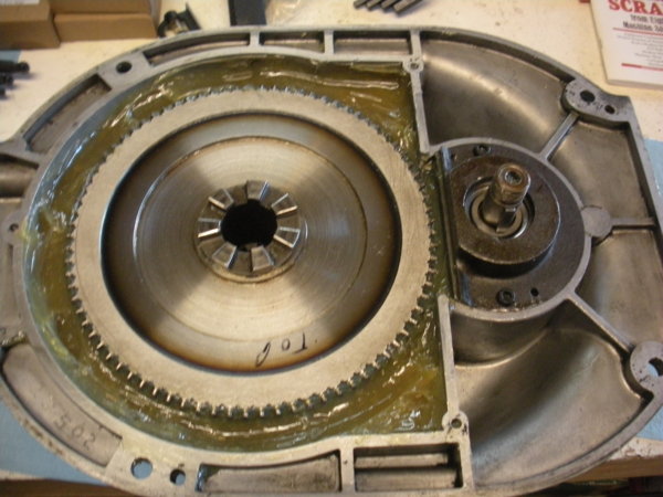 Over head view of the gear housing packed with grease. Leave other areas empty.