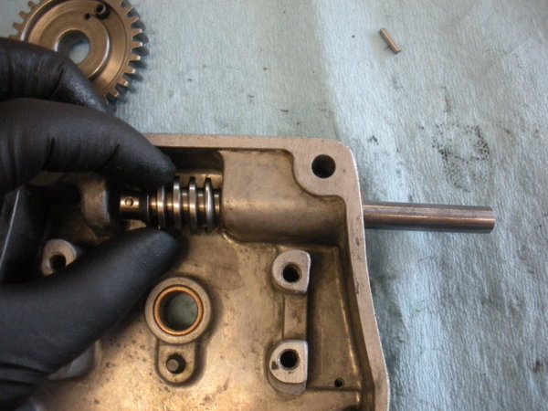 Slide the worm gear on to the shaft. Line up the drilled holes in the shaft with the ones on the gear. :)