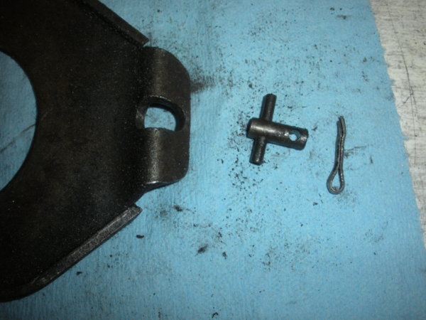 Speed change plate, T-bolt?, and cotter key that holds the adjustment chain to the plate.