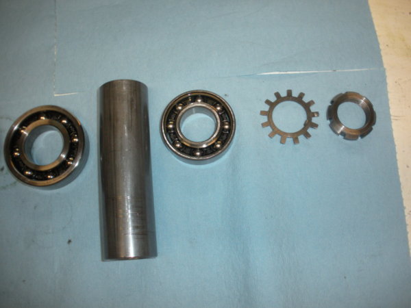 spindle assembly order starting at top of bearing set moving to the right (up the spindle)