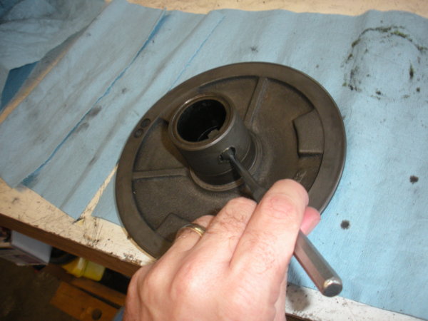 Start by tapping out the key in the Adjustable vari-disc from the spindle pulley(the motor pulley has a threaded key)