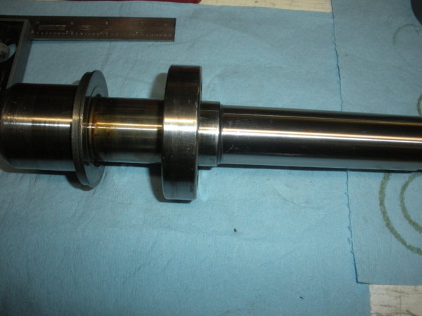 The spindle with the dirt shield and lower bearing. Just after the spacers and top bearing from the set came off.
