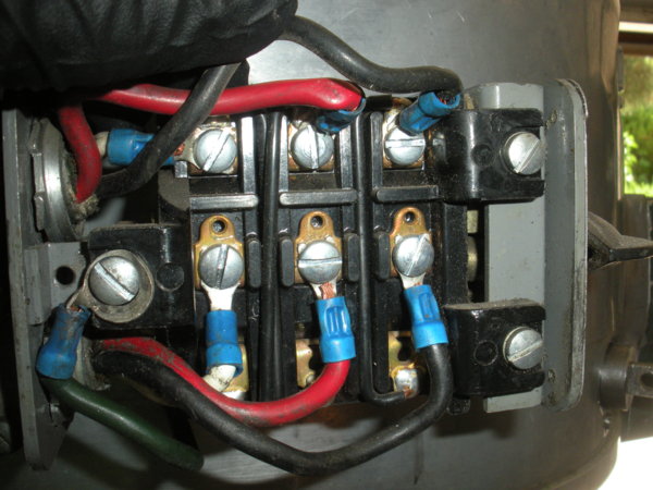 The upper wires are the motor wires. The lower are the "line" wires coming in from the power source.  Center screw to left is ground.