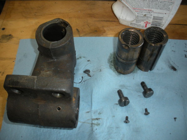 The yoke with the feed nuts removed. Showing adjustment screws and locking screws.