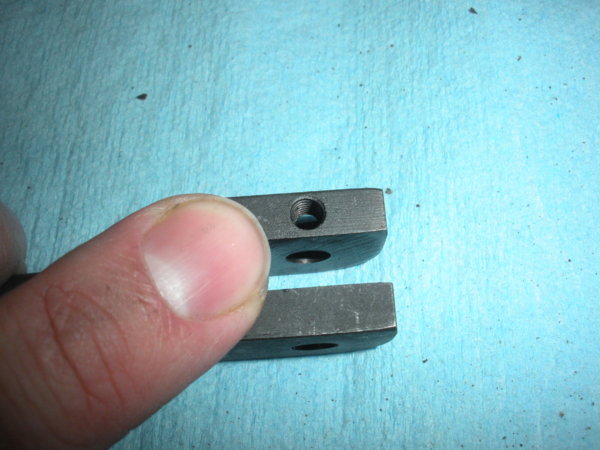 There is where the set screw holds the pin in place...this faces out. Seems obvious but anyway. :)
