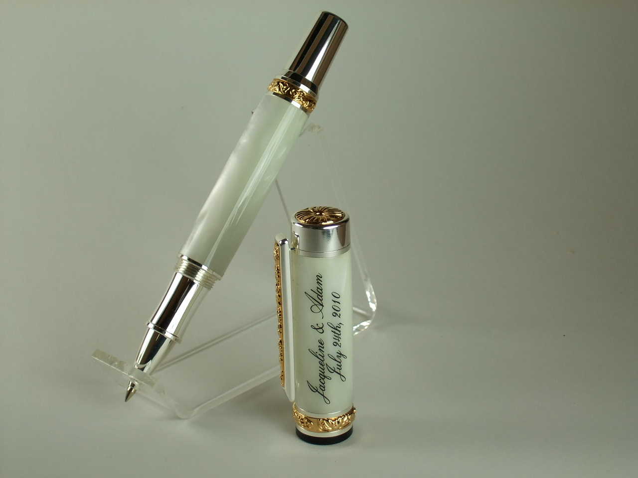 Wedding pen made for some friends. Sterling silver & gold titanium with a white pearl body. Looks awesome in person.